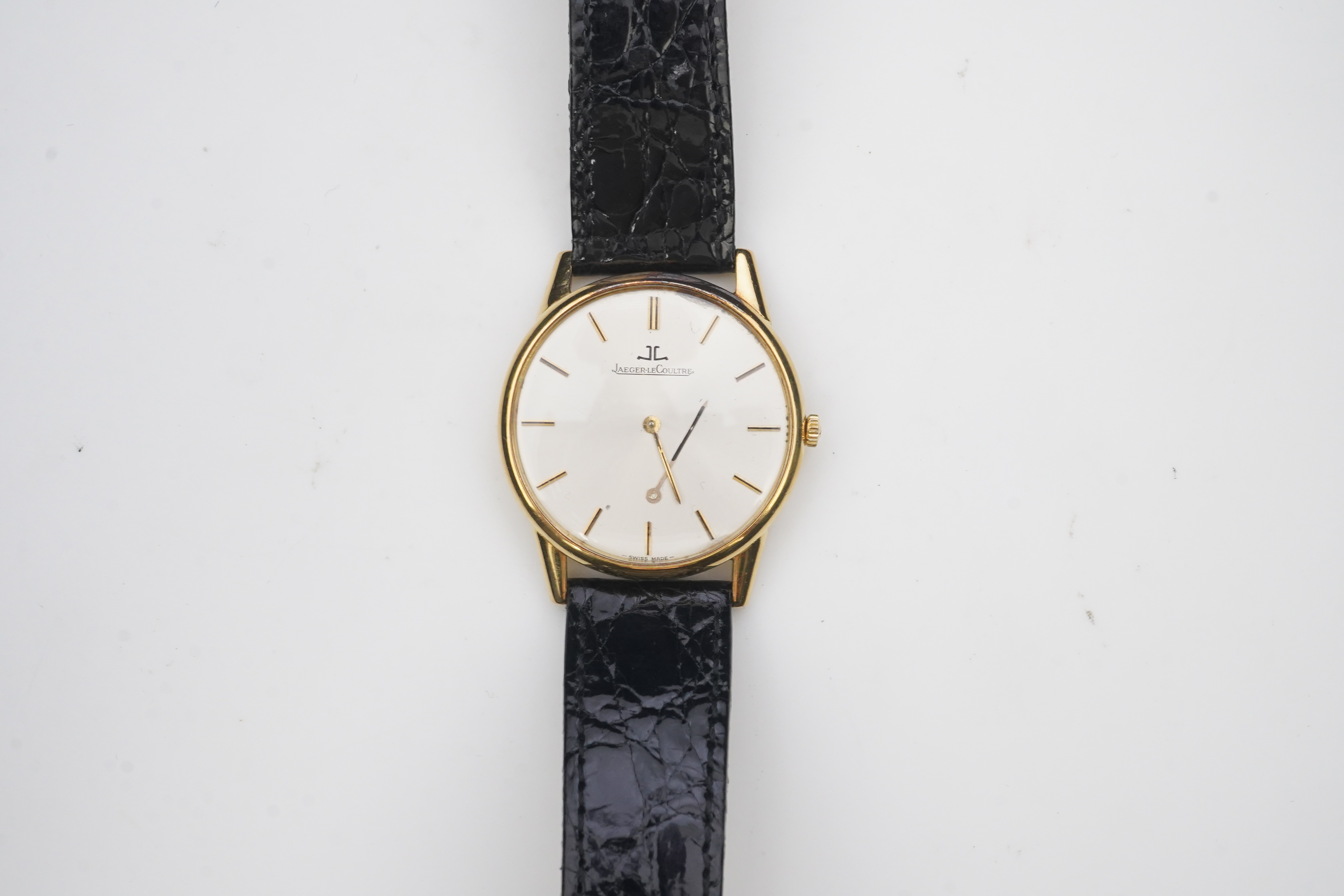 A gentleman's 18ct gold Jaeger LeCoultre manual wind dress wrist watch, on a later associated leather strap